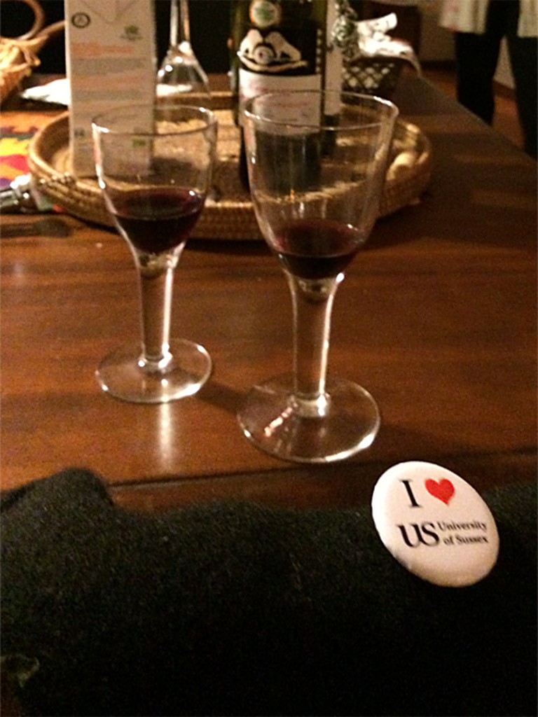 Two glasses of wine and an 'I love Sussex' budge